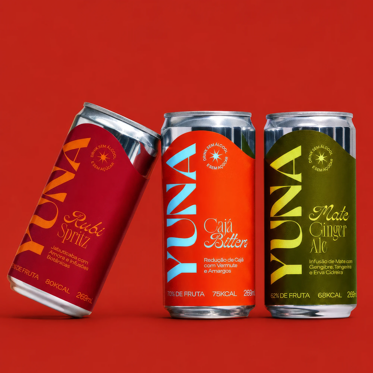 Latas de Rubi Spritz, Cajá Bitters e Mate Ginger Ale do Kit Trio YUNA sobre fundo vermelho